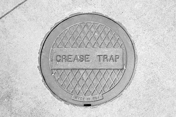 neglecting grease trap pumping can lead to blockages, foul odors, and potential environmental violations